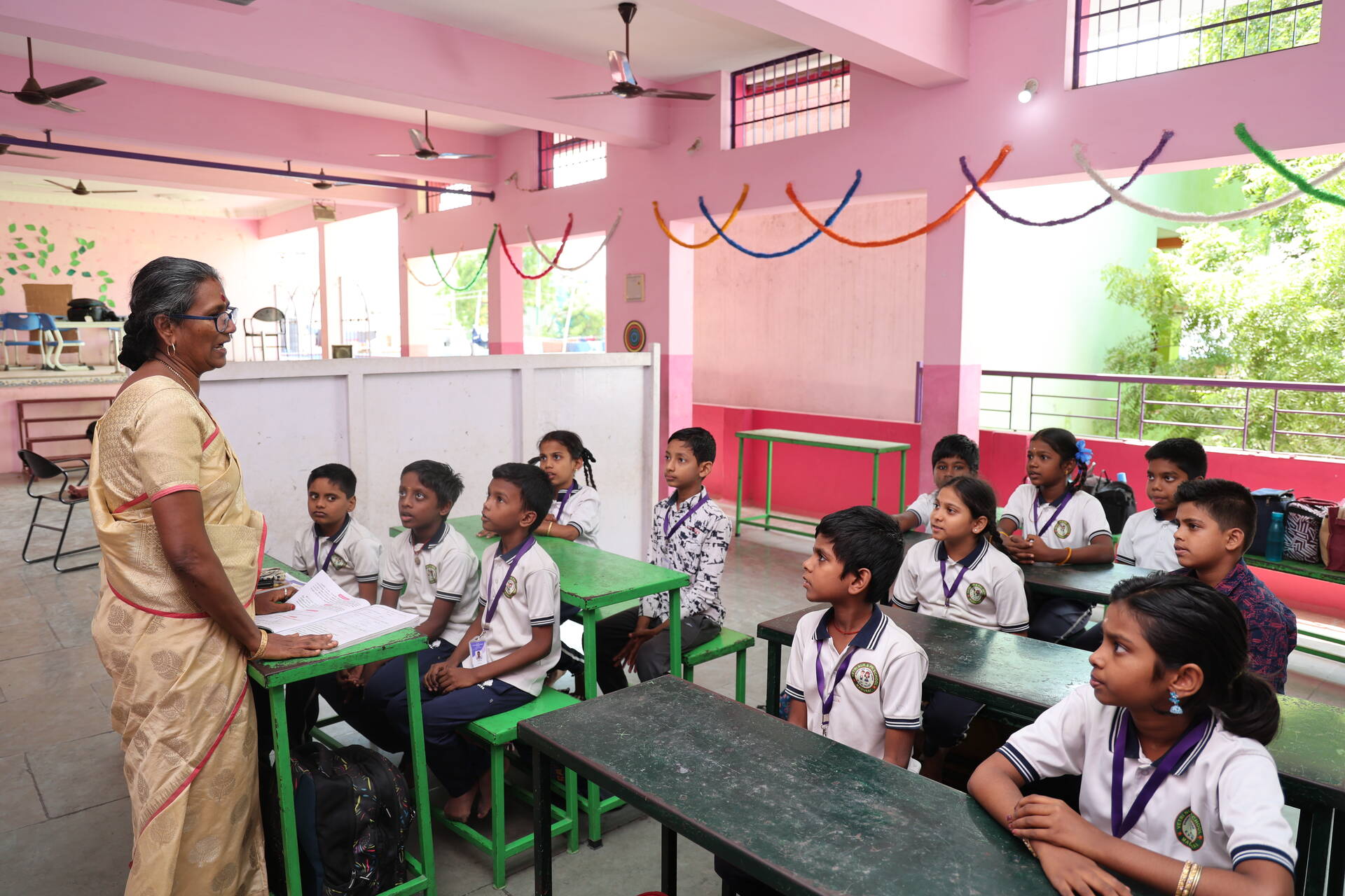 Thamil Selvi engages learners in a classroom activity, creating an interactive environment that encourages participation and learning. Photo Credit: Jason Amoo/Opportunity International